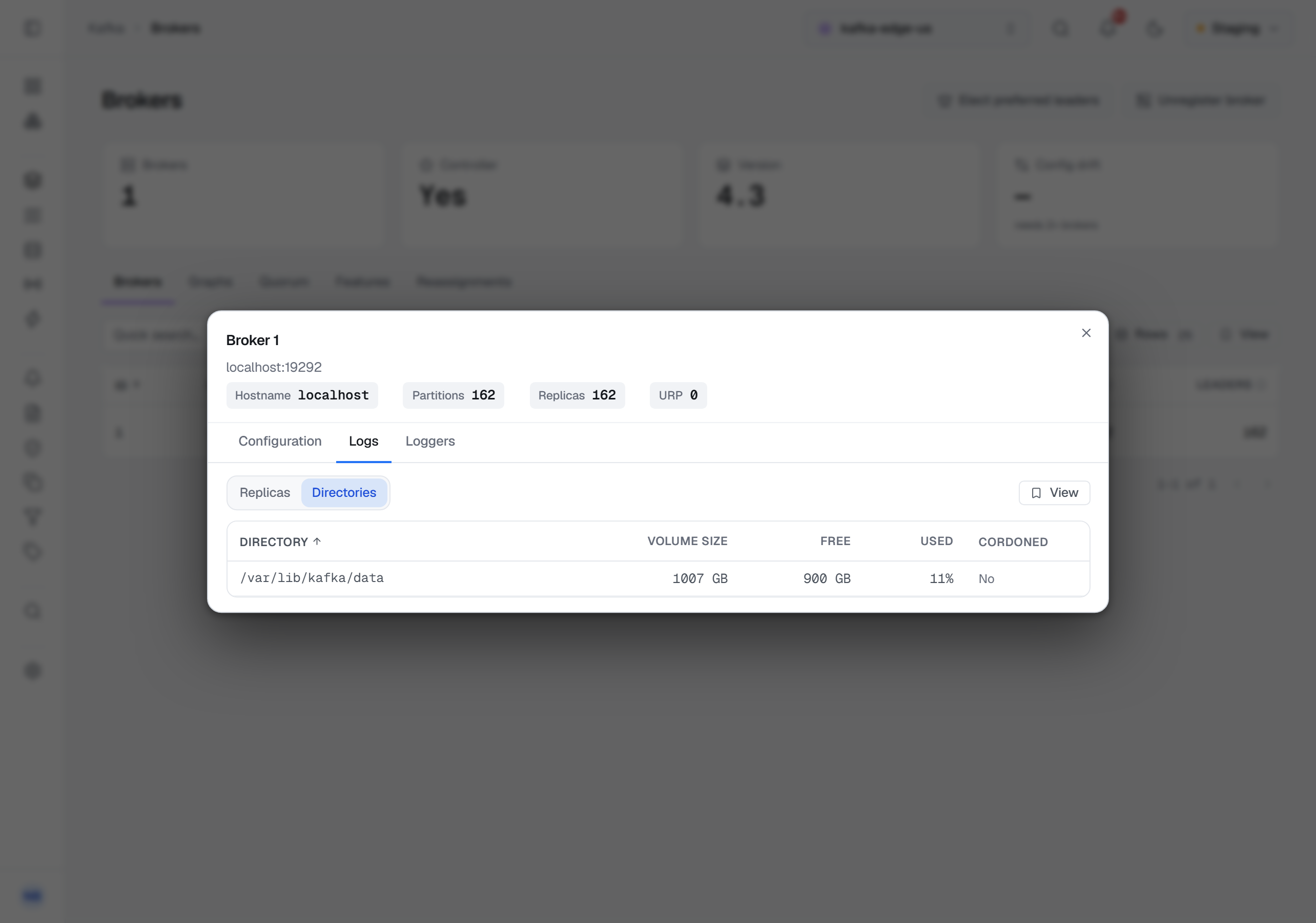 The broker modal's Logs tab on Directories, on a Kafka 4.3 broker: one log directory, /var/lib/kafka/data, on a 1007 GB volume with 900 GB free and 11% used, and Cordoned reading No.