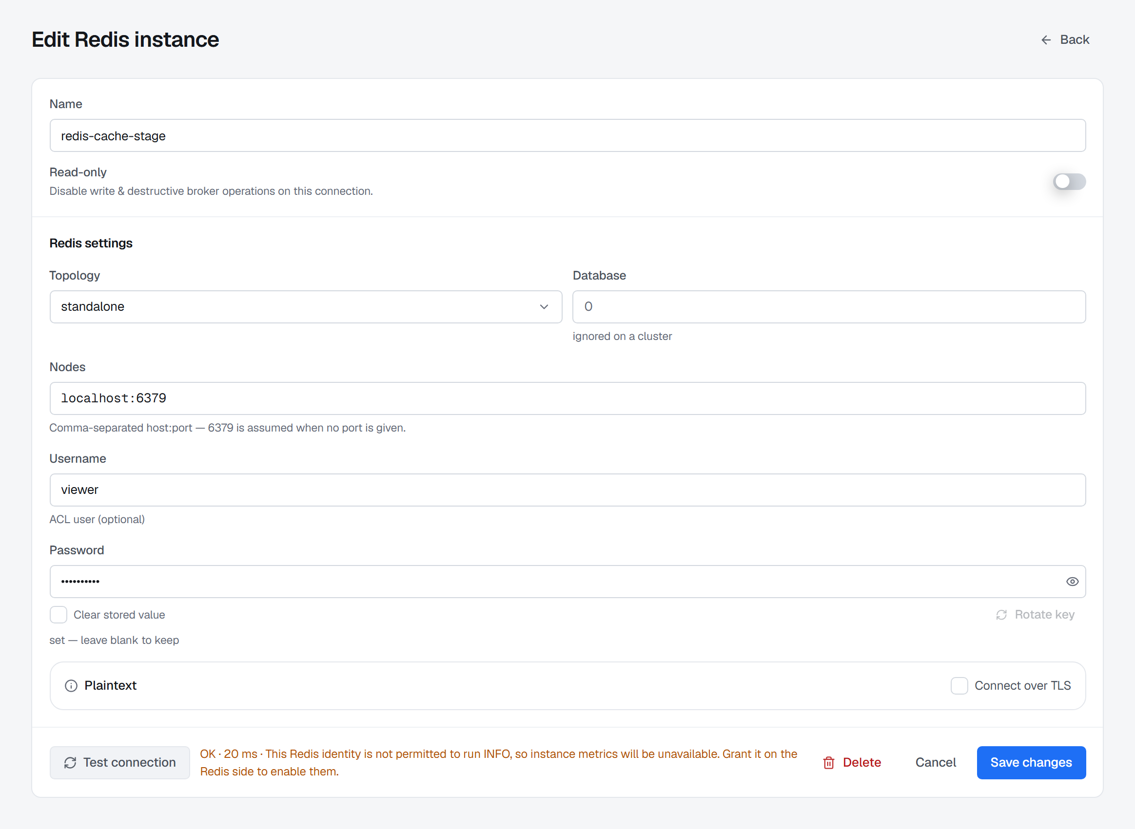 A Redis connection form tested as the identity 'viewer'. Beside the Test connection button the verdict reads OK, with its latency, then 'This Redis identity is not permitted to run INFO, so instance metrics will be unavailable. Grant it on the Redis side to enable them.'